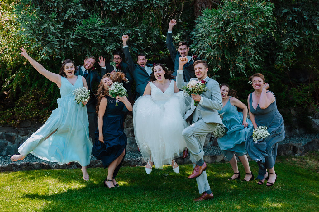 Newlyweds and wedding party celebrate at Arbutus Ridge Golf Course