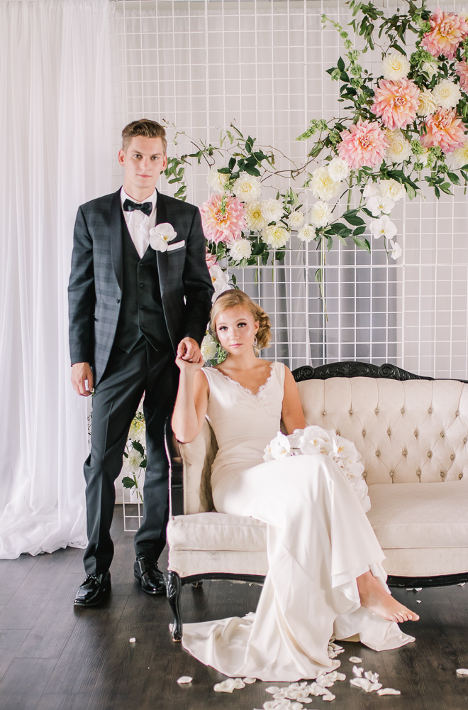 Fresh + Modern Wedding Inspiration couple sit on cream settee