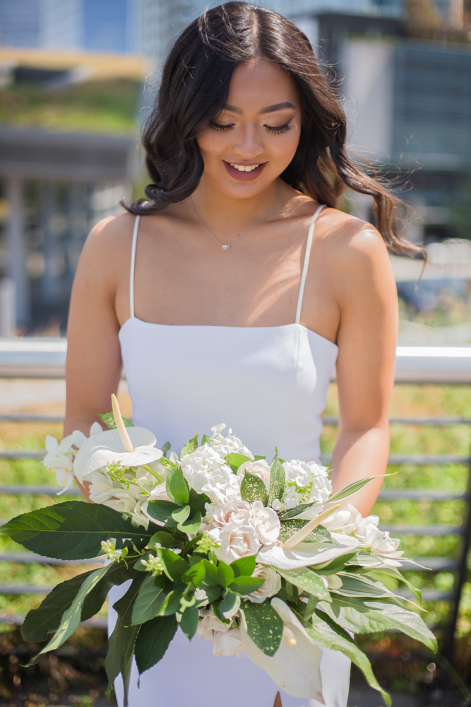 City Chic Bride and bouquet of white lilies