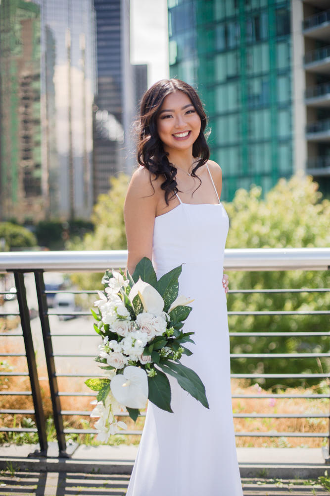 Vancouver bride holds Karen Wazny bouquet of white lilies