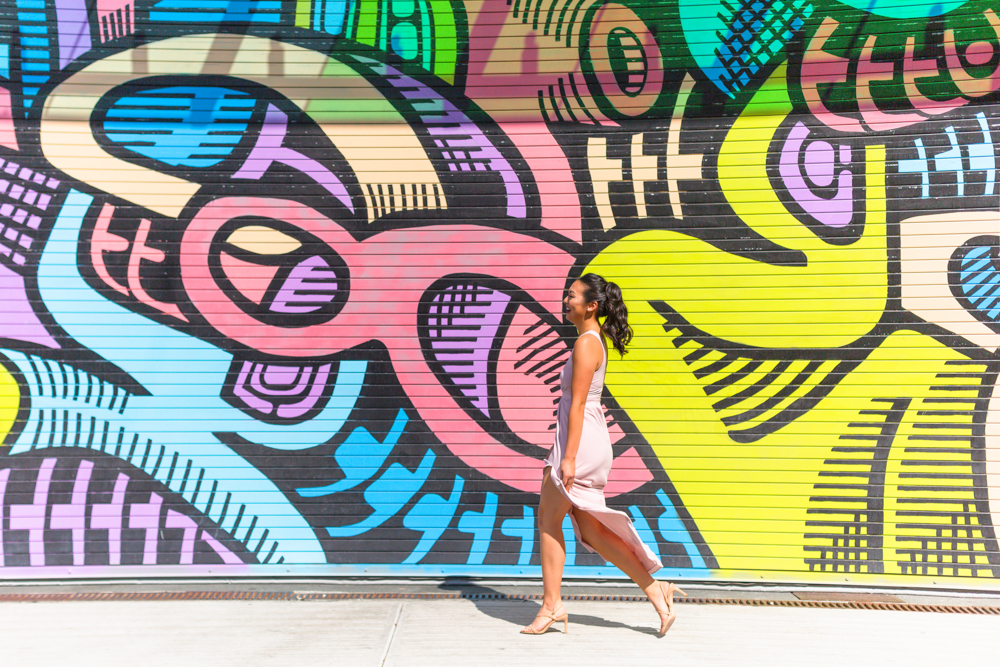 Bride walks in front of Vancouver graffiti