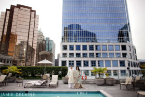 Wedding Couple standing in front of the Vancouver Fairmont Waterfront