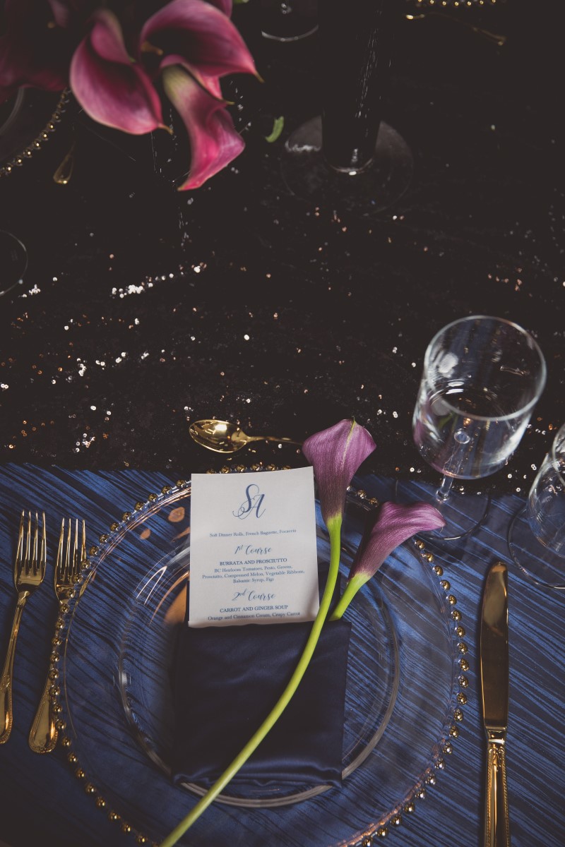 Sophisticated Table Setting by Paradise Events in Vancouver with burgandy calla lily and glass charger plate 