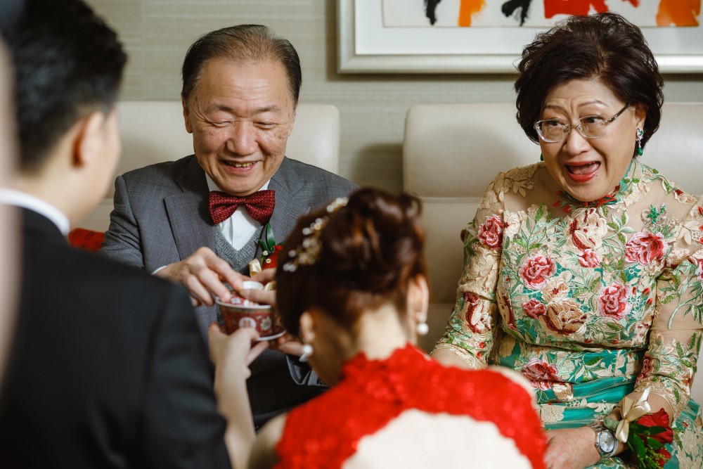 Couple bow before grandparents in traditional tea ceremony in Vancouver