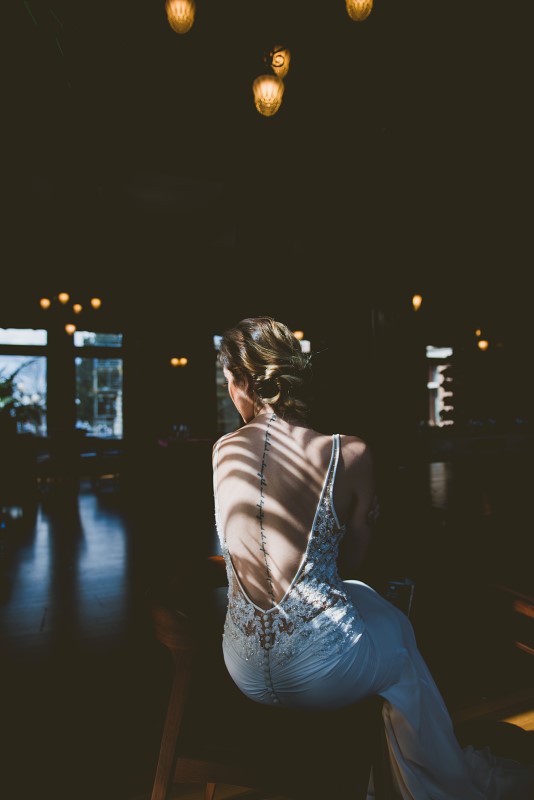 Tropical Empress Wedding bride with hair by Hunt and Gather in dappled sunlight on Vancouver Island 