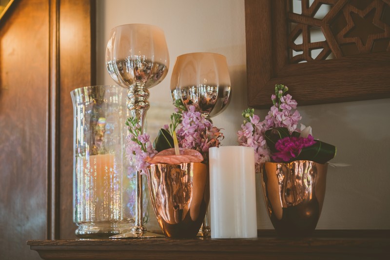 Tropical Empress Wedding decor on fireplace mantle by Party Mood Vancouver Island