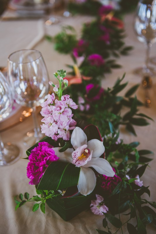 White orchid on sweetheart table at Fairmont Empress by Brown's the Florist