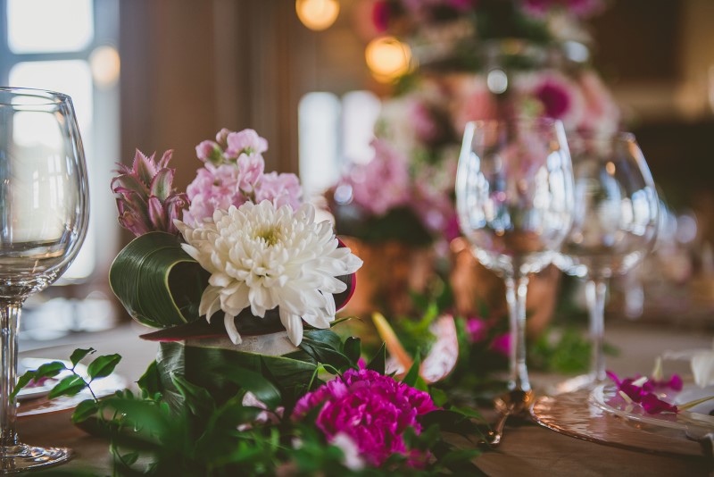 Crystal Glasses reflect Fairmont Empress reception table of tropical flowers by Brown's the Florist 