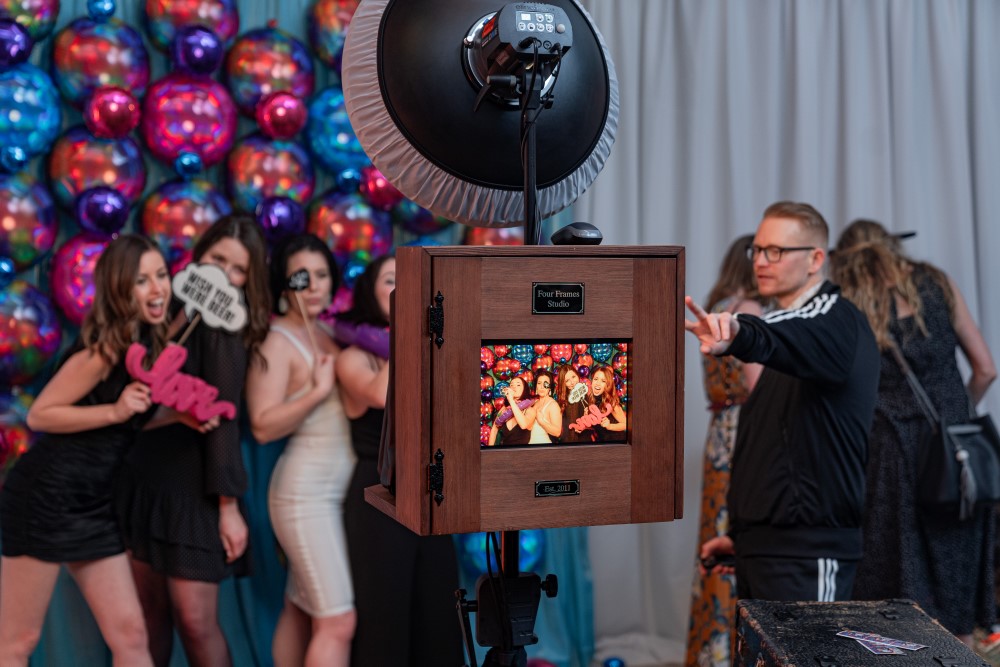 Four Frames Photo Booth takes photos in front of balloons at Vancouver Island Wedding Awards 2020