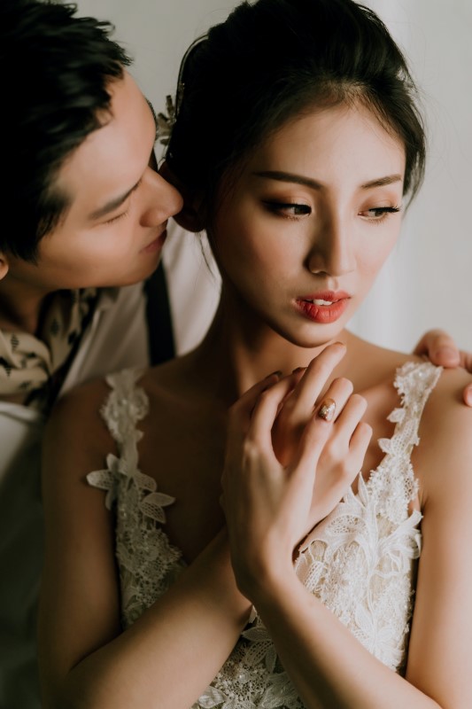 Dreamy White Wedding gclose up of groom whispering in bride's ear