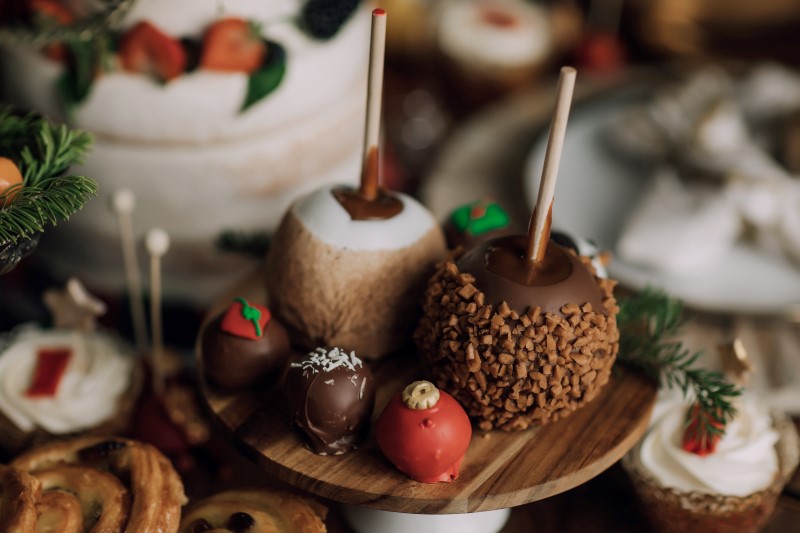 Culture Fusion dessert display with cake pops, cupcakes and candied apples