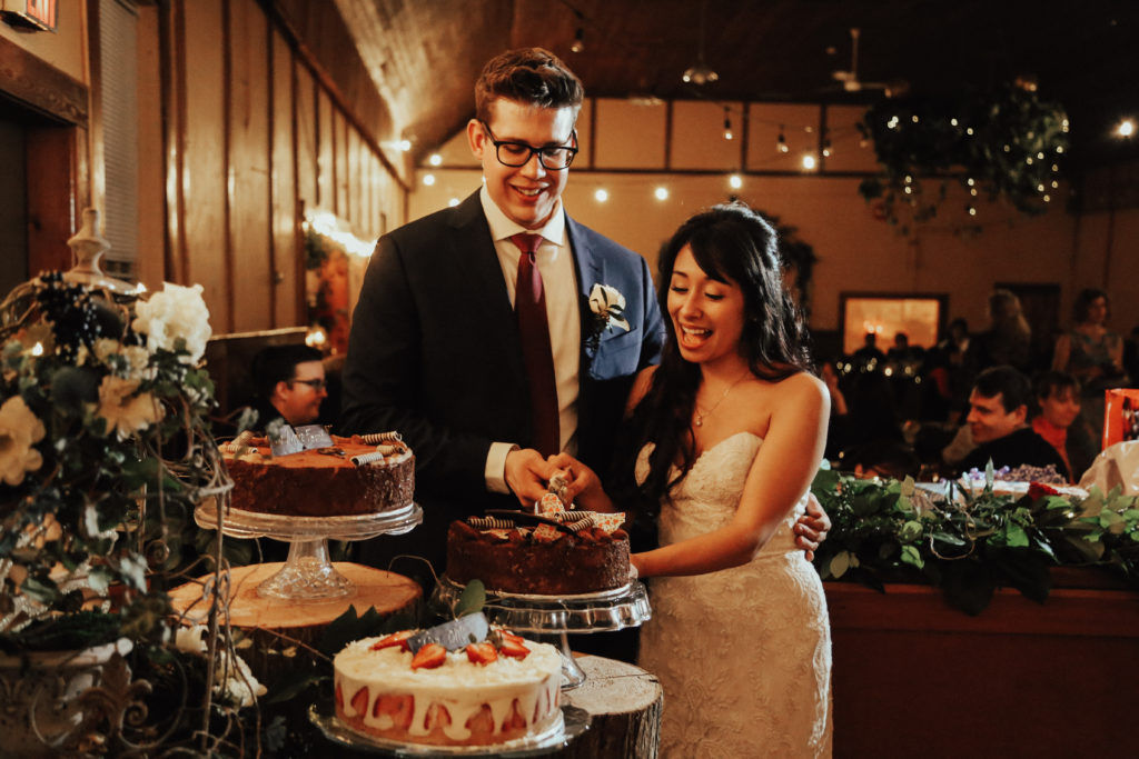 Steal of a Wedding bride and groom cutting their wedding cakes from Murchie's Victoria Cafe