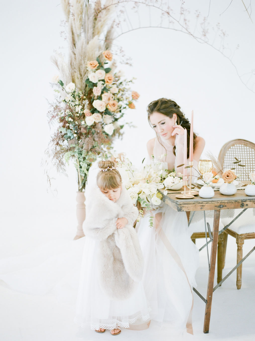 Simply sweet bride surrounded by roses and pampas grass