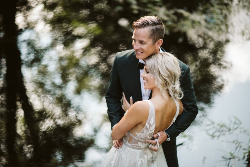 Wedding couple laughing by Erin Wallis Photography