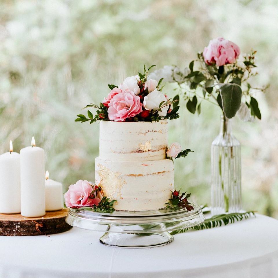 Naked Cake with White Icing and Pink Roses by Tofino Cake Studio