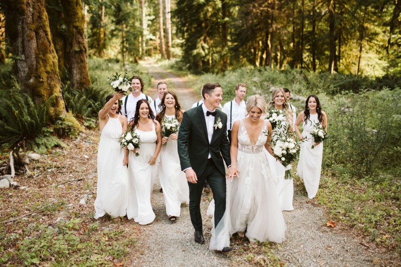 Wedding Party walks down path in the woods on Vancouver Island