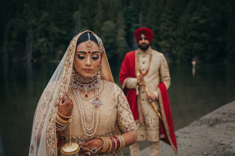 Coastal Luxury Indian Wedding Newlyweds beside lake near Vancouver