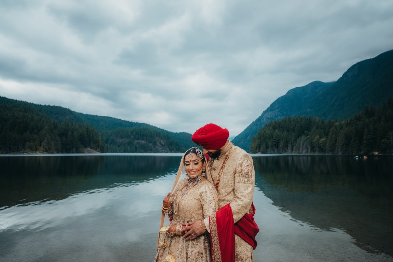 Coastal Luxury Indian Wedding bride and groom by Rocky Mountain Lake by Dreamfinity Studio