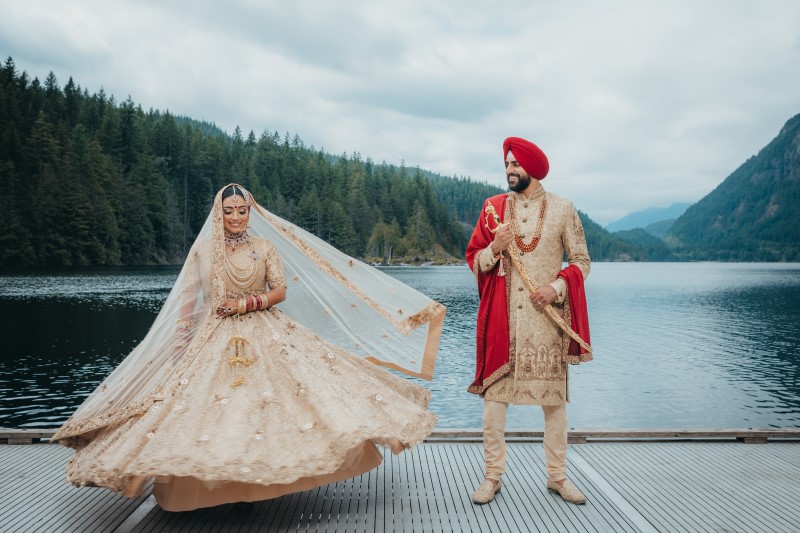 Bride and Groom in traditional Indian wedding finery by Dreamfinity Studios