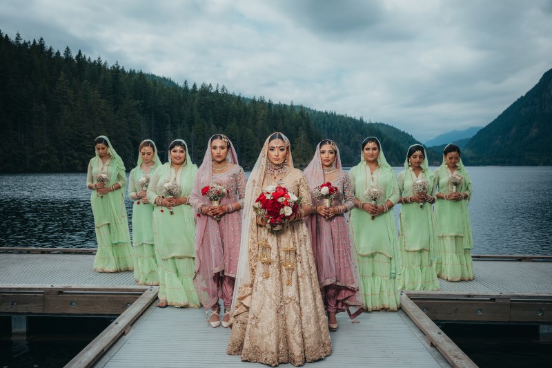 Coastal Luxury Indian Bride and Bridemaids in Blush and Green Sarees by Vivah Collection