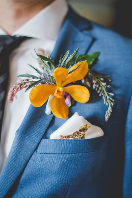 Orange Boutonnière on Blue Suit by Hughs Clothing