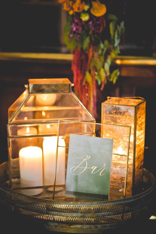 Candles inside of glass prisms on glass table by DragonFlight PHotography and The Good Party 