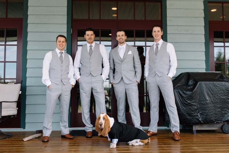 Groomsmen with hound dog wearing suits by Moores Clothing for Men on Vancouver Island