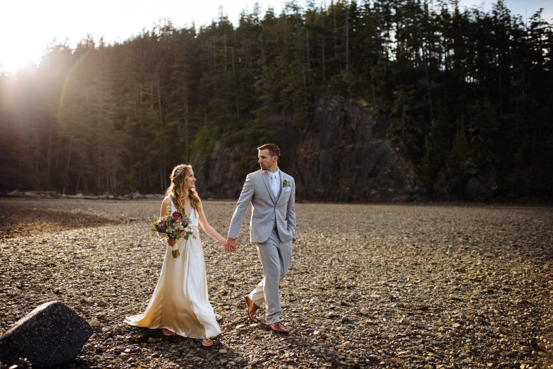 Seaside Romance Newlyweds Holding Hands by Lavish Engagements