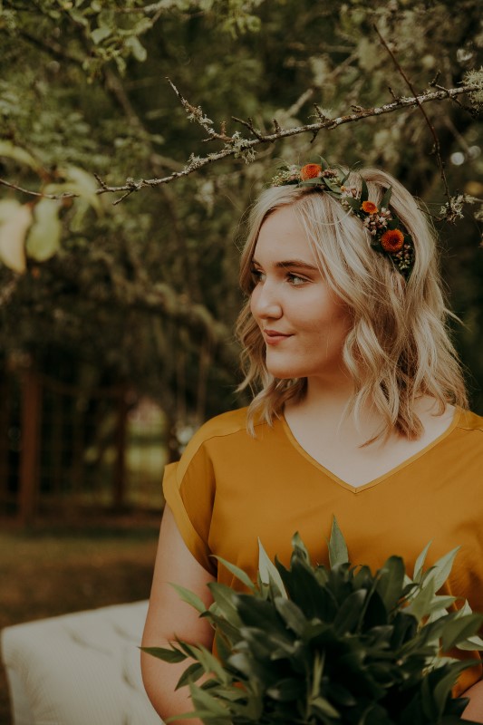 Bridesmaid with flower crown and yellow blouse at Vancouver Island Wedding LumiPhoto