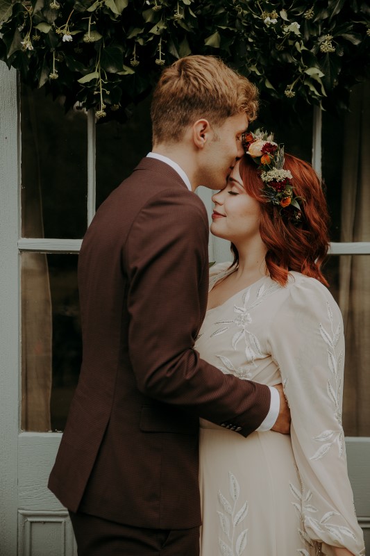 Newlyweds in front of anitique door at Bilston Creek Farm LumiPhoto