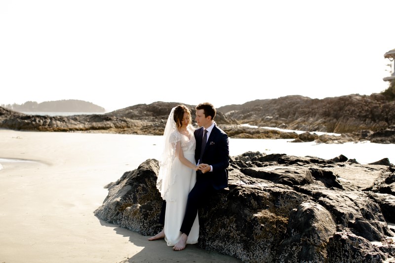 Rainforest Vows Couple Pose On Beach Rocks at Wickaninnish Inn