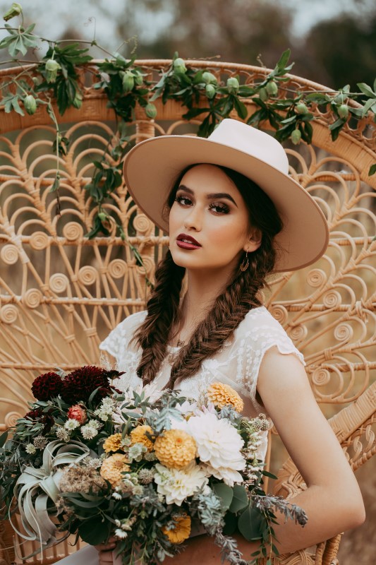 Southwest Style Bride with Hat and Colorful Bouquet Captured by Henhouse Photo Co.