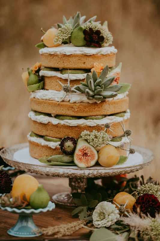 Stylish Southwest Wedding Cake With Fruit Decor by Cobble Hill Cake Co.