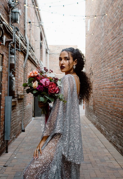 Urban Elopement Bride Holds Bouquet by En Vied Events