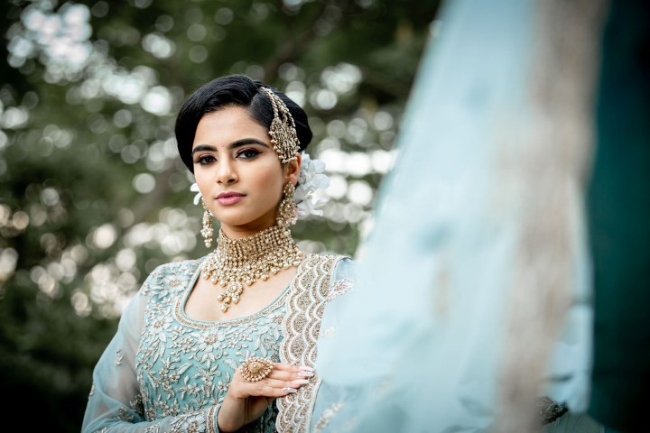 Bride in ice blue and white lace sari by Diamonds Edge Photography