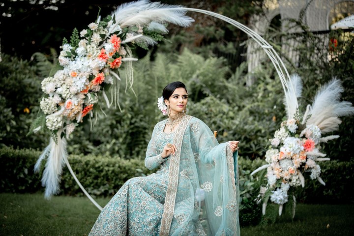 Wedding ceremony hoop with feathers, dahlias and greenery at Westin Bayshore