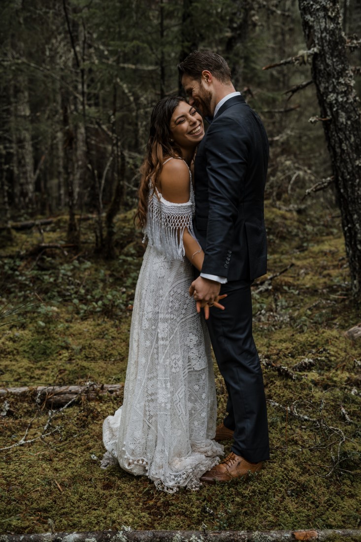 Bride and Groom embrace at Spectacle Lake Eva Cherneff collective 