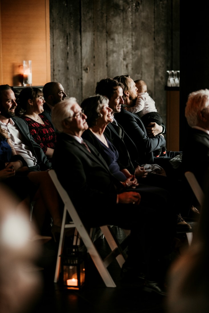 Wedding Guests watch ceremony raptly by Jen McLeod Photography