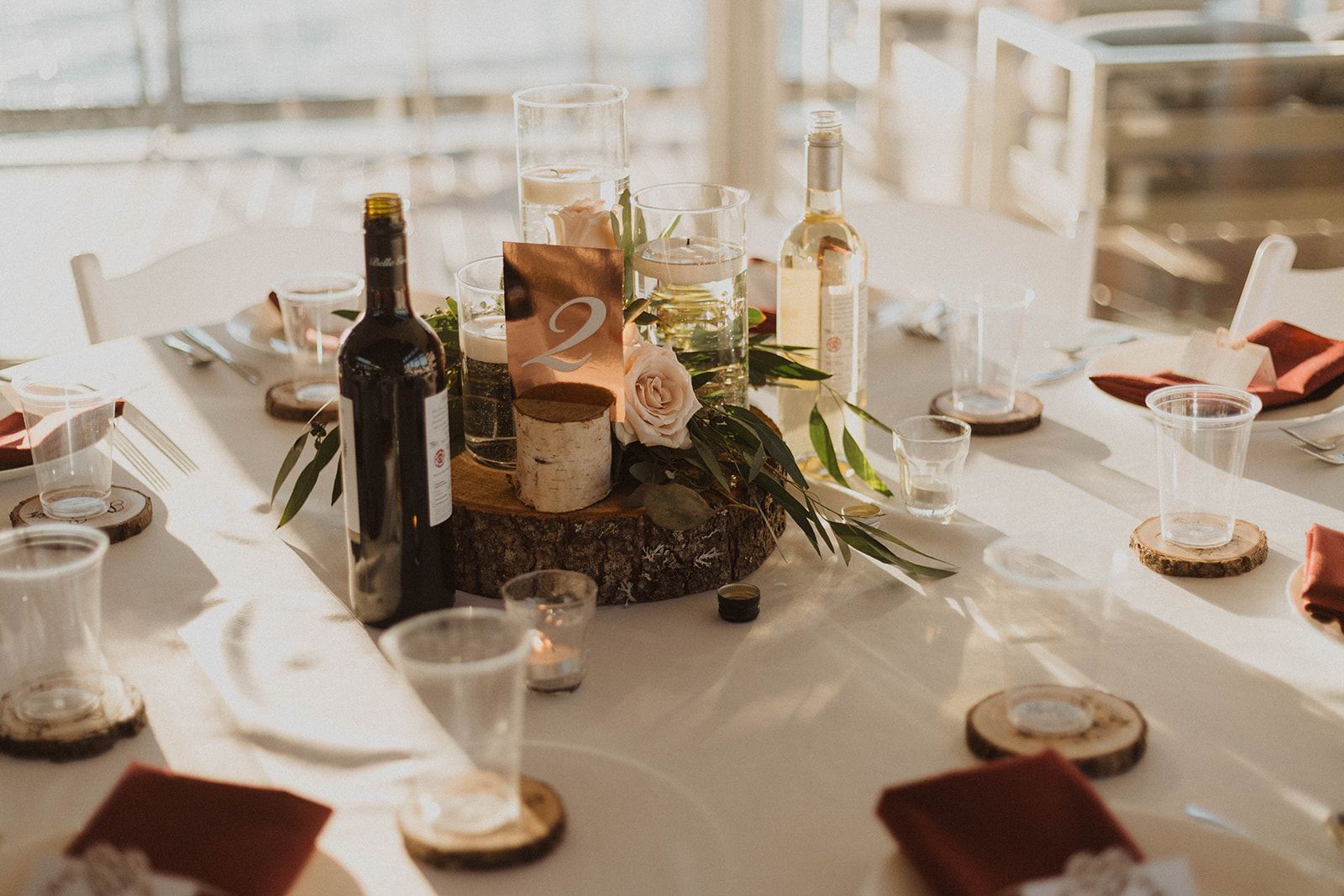 UBC Boathouse table decor floating candle with blush pink roses and eucalyptus by West Coast Weddings Magazine