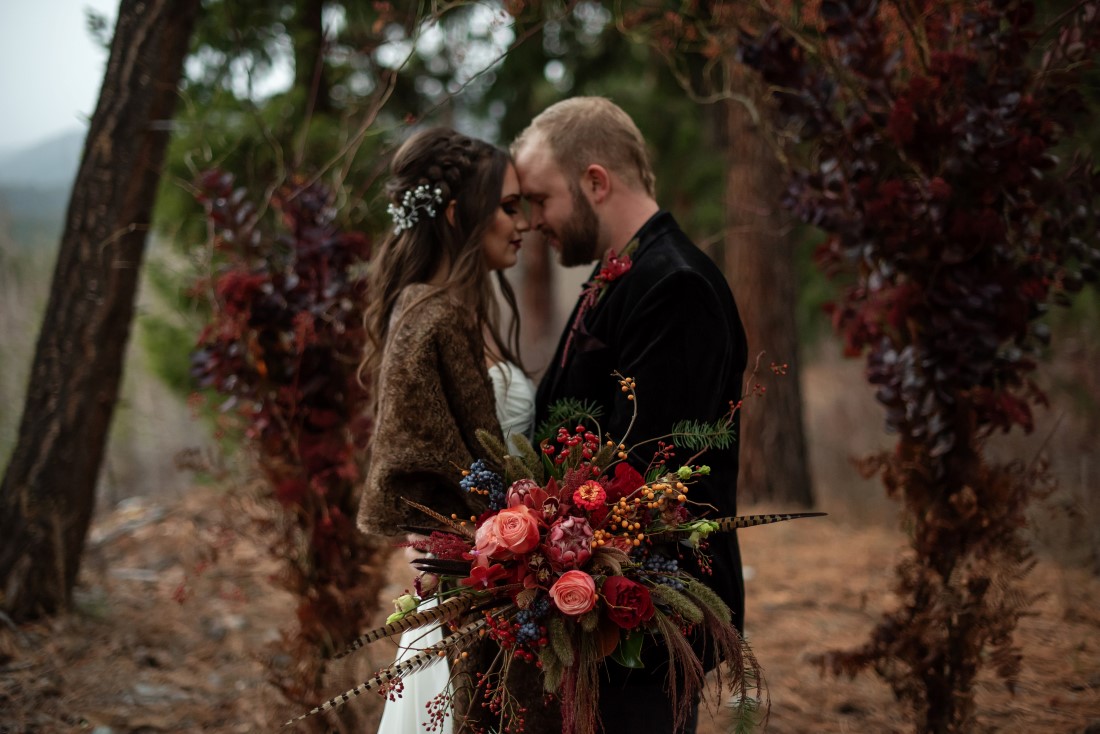 Eloping wedding couple in the woods outside Vancouver