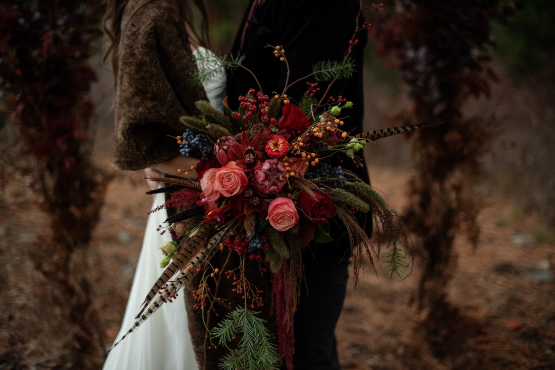 Bridal Bouquet of deep pink roses and protea by Deborah Lee Designs