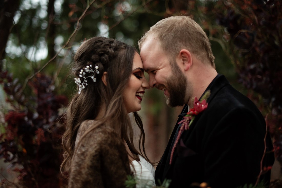 Bride with crown braids and flowers in her hair by Vancouver Makeup 