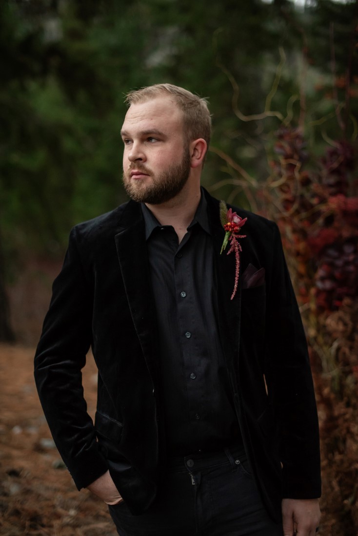 Groom in black velvet jacket and black shirt with boutonniere by Cardero Clothing Vancouver