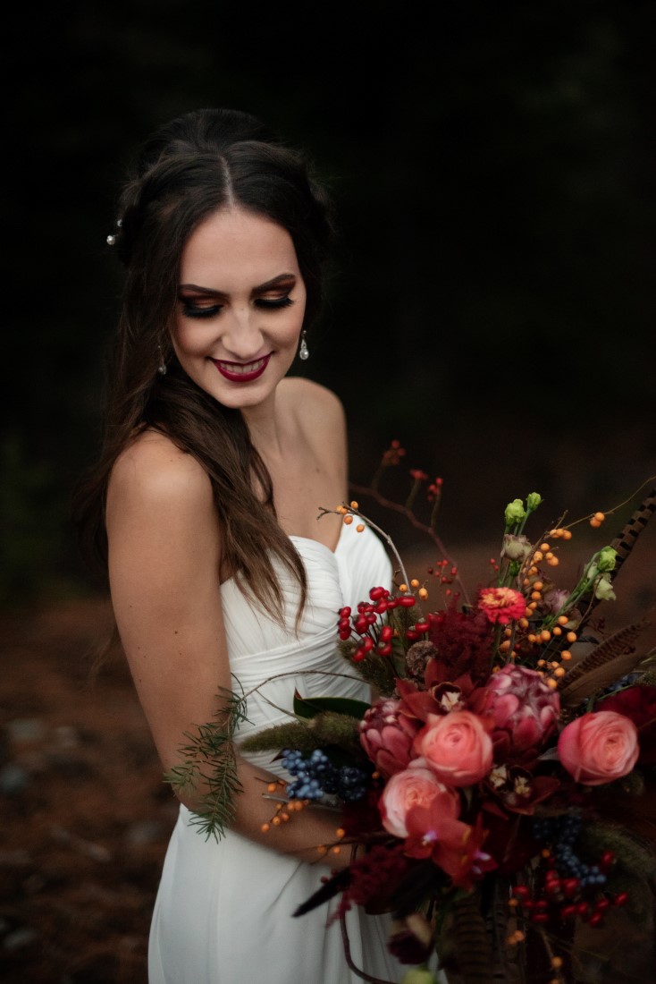 Bride carrie bouquet of deep rose flowers with protea by Deborah Lee Designs