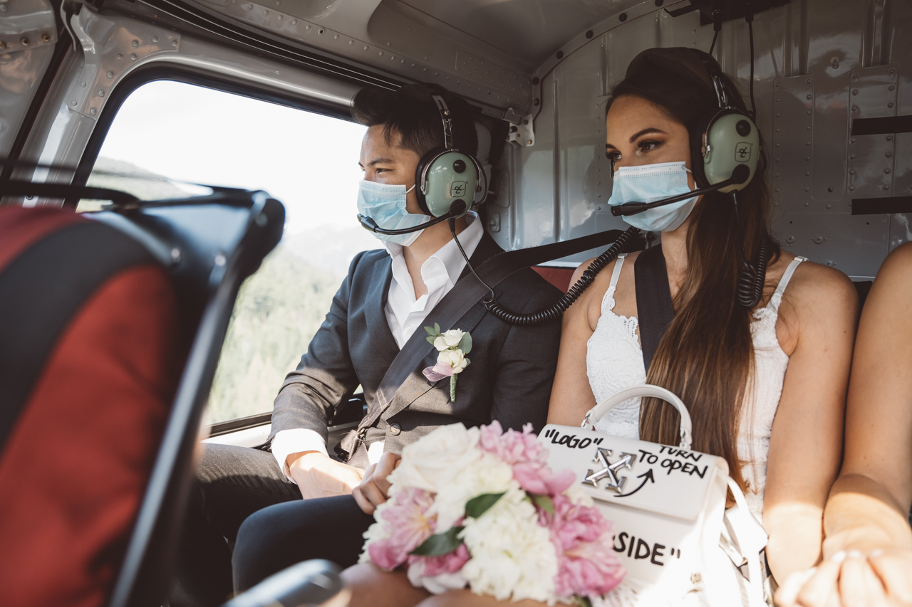 Couple in Blackcomb Helicopter wear masks while flying to wedding ceremony