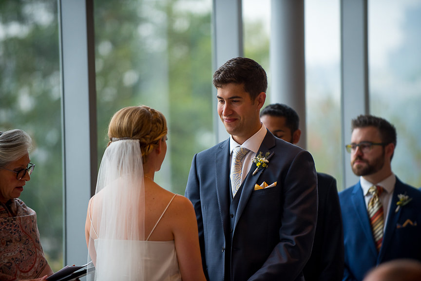 Wedding Couple exchange vows at Museum of Vancouver 