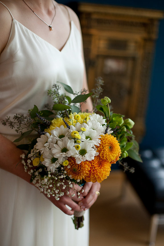 Bridal bouquet of white, yellow and orange gerbera daisies 