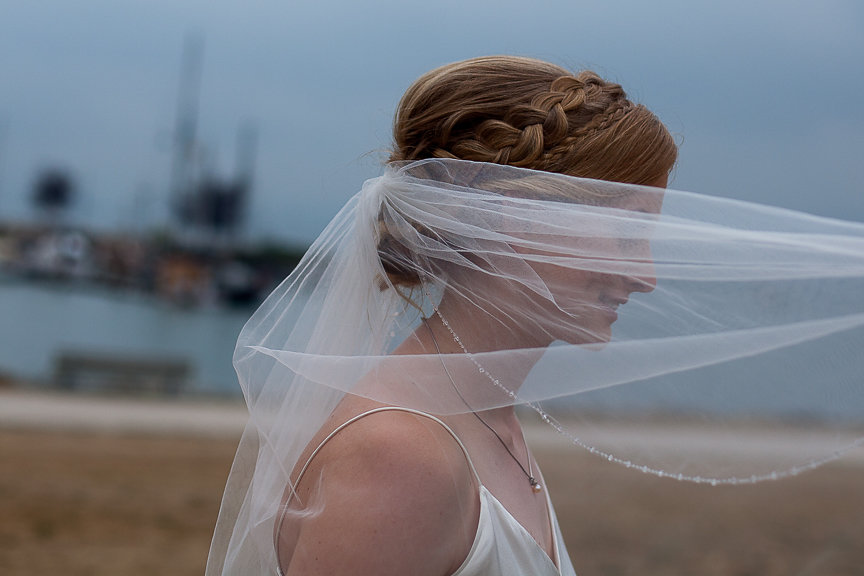 Bride with veil over her face by Everly Fine Bridal Vancouver