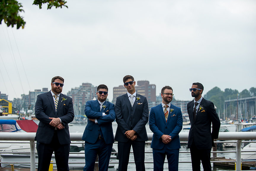 Groomsman on the docks of Vancouver by Meghan Andrews Photography