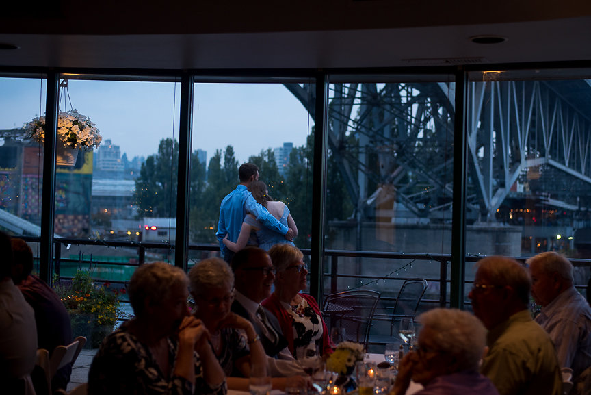 Wedding on the Water guests enjoy the view at False Creek Yacht Club Vancouver